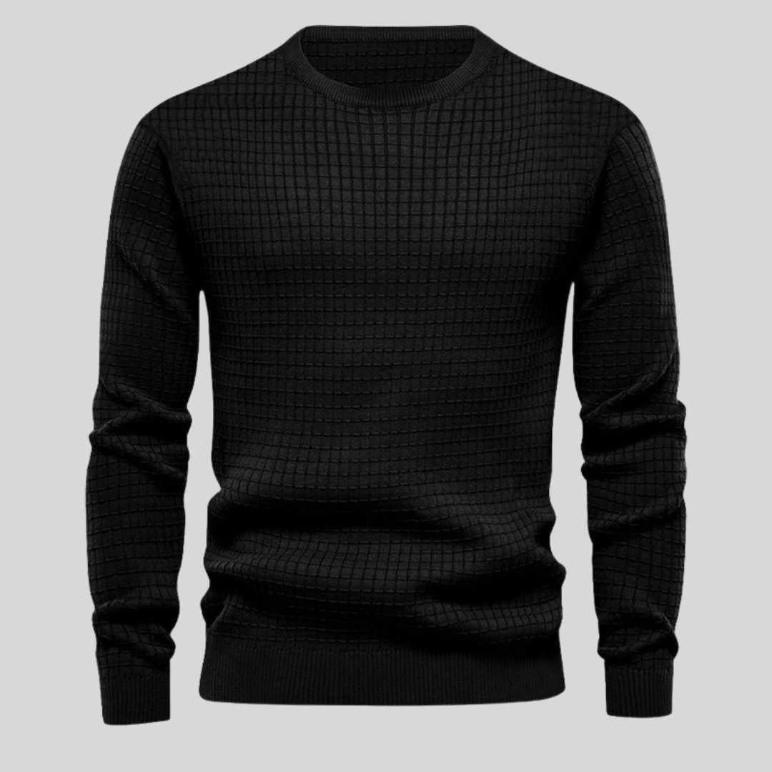 Schwarzer Herrenpullover mit Karomuster, Rundhalsausschnitt und langen Ärmeln. Modischer Strickpullover für Herbst und Winter.