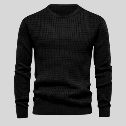 Schwarzer Herrenpullover mit Karomuster, Rundhalsausschnitt und langen Ärmeln. Modischer Strickpullover für Herbst und Winter.