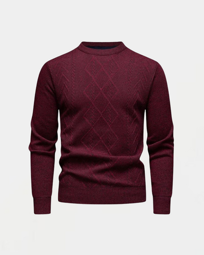 Bordeauxroter Herrenpullover mit Rautenmuster, Rundhalsausschnitt und langen Ärmeln. Eleganter Strickpullover für Herbst und Wintermode.