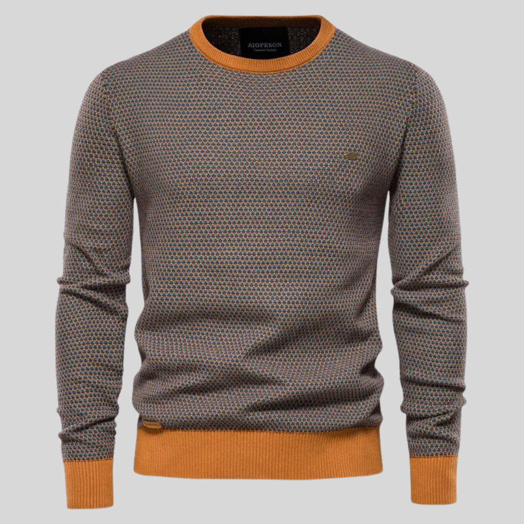 Herrenpullover mit geometrischem Muster, Rundhalsausschnitt und orangefarbenen Bündchen. Modischer Strickpullover für Herbst und Winter.