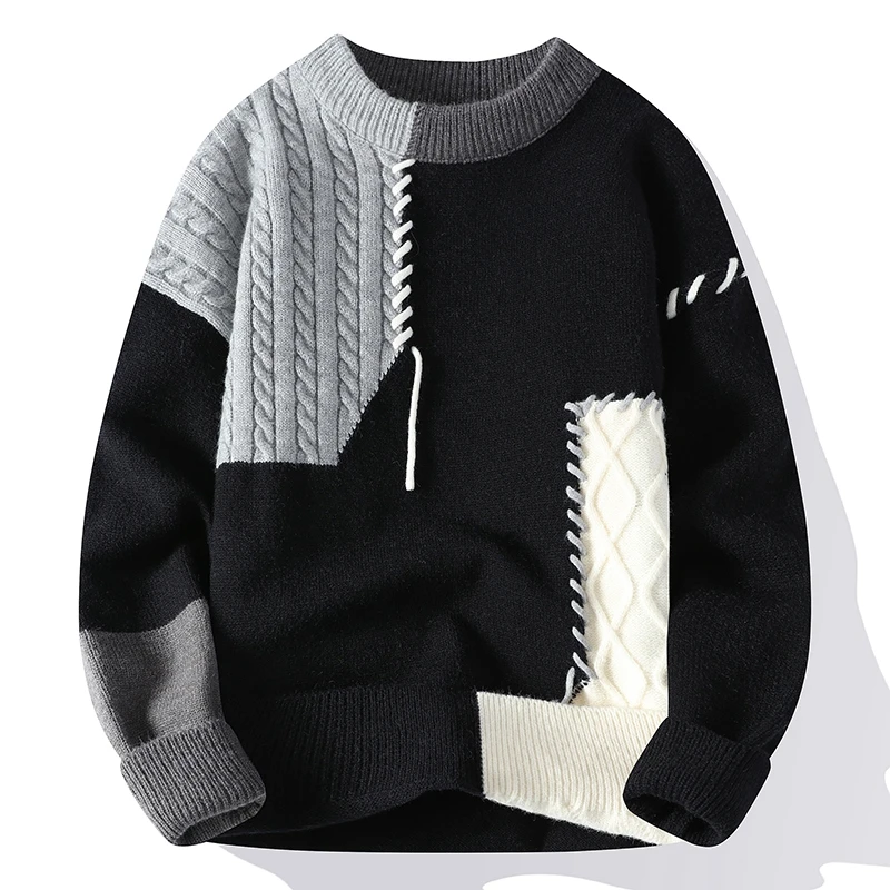Schwarz-grauer Patchwork-Pullover mit Zopfmuster, Rundhalsausschnitt und kontrastierenden Strickdetails. Modischer Herrenpullover für Herbst/Winter.