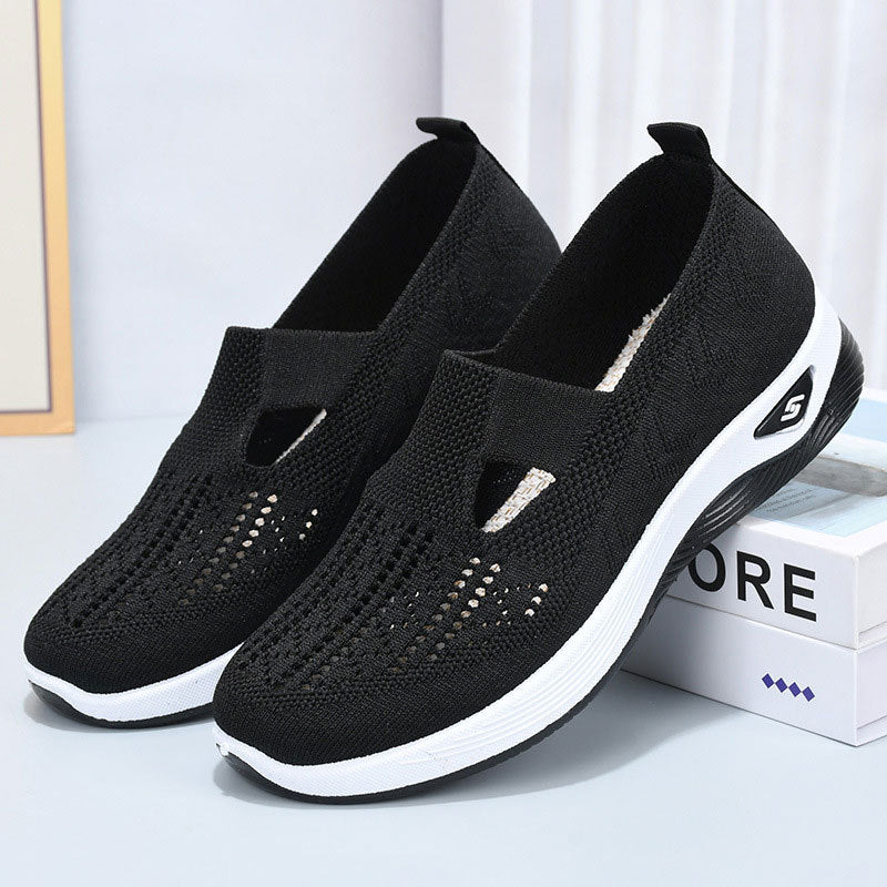 Schwarze Damen-Sneaker mit atmungsaktivem Mesh-Obermaterial und weißer Sohle, ideal für Sport und Freizeit. Bequeme, modische Schuhe.