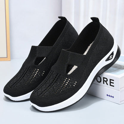 Schwarze Damen-Sneaker mit atmungsaktivem Mesh-Obermaterial und weißer Sohle, ideal für Sport und Freizeit. Bequeme, modische Schuhe.