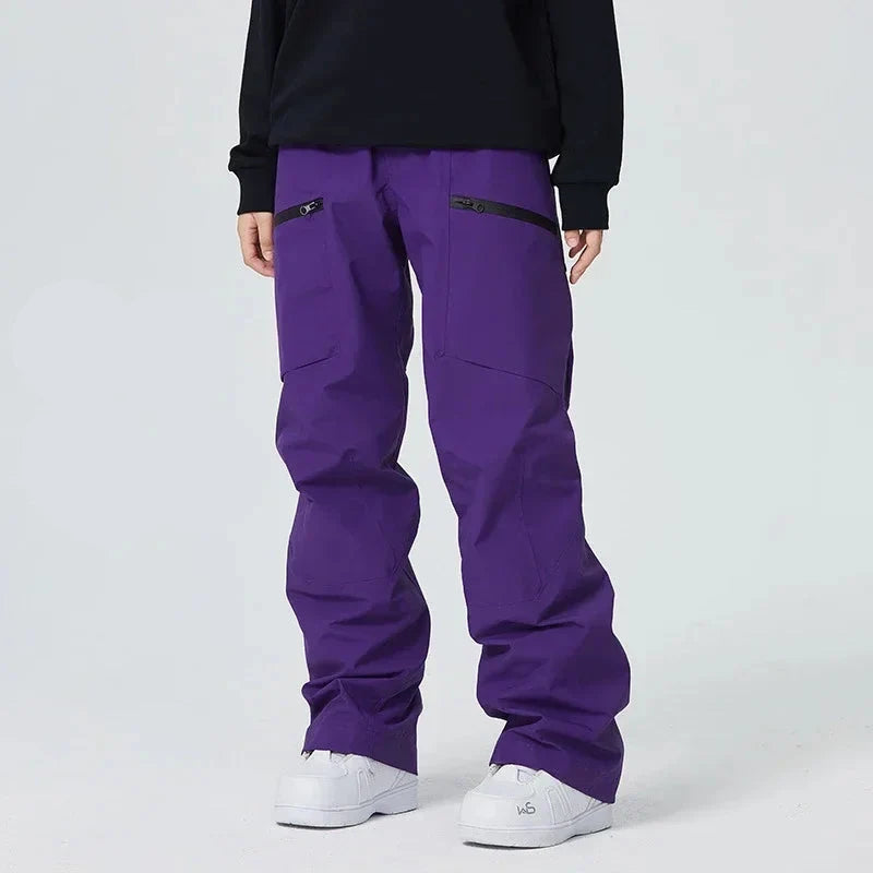 Lila Skihose für Damen, wasserdicht, atmungsaktiv, mit Reißverschlusstaschen, ideal für Wintersport und Outdoor-Aktivitäten.