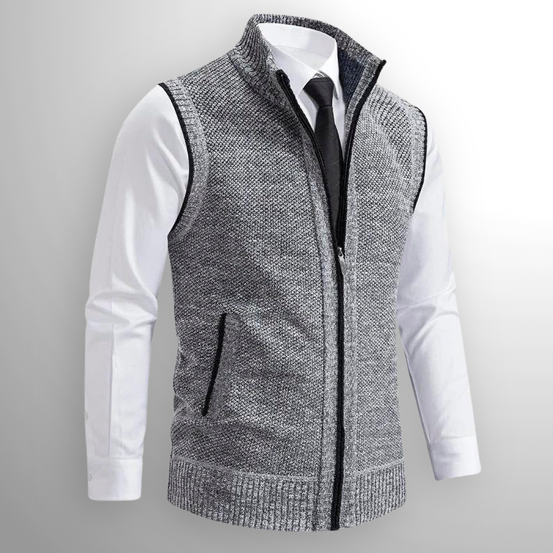 Graue Strickweste mit Reißverschluss über weißem Hemd und schwarzer Krawatte, elegante Herrenmode, stilvoller Business-Look, Herbstmode.